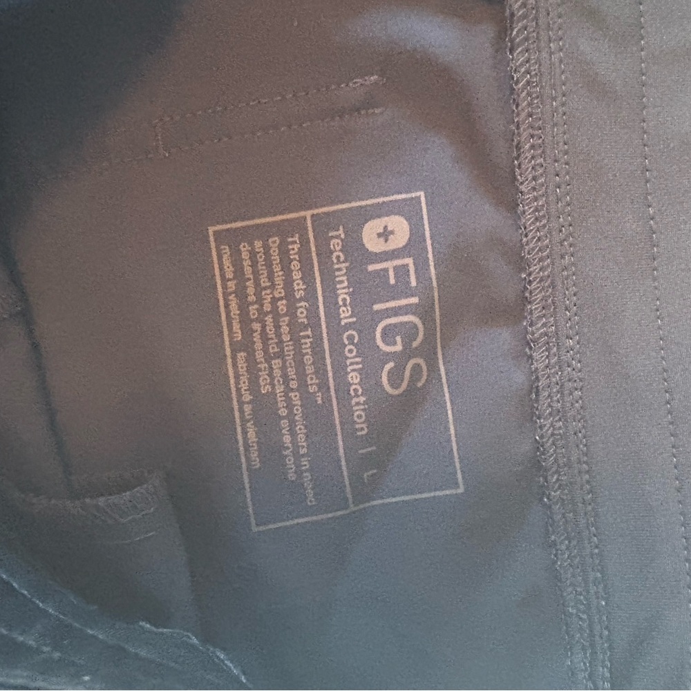 FIGS Technical Collection Pants in midnight blue / green color